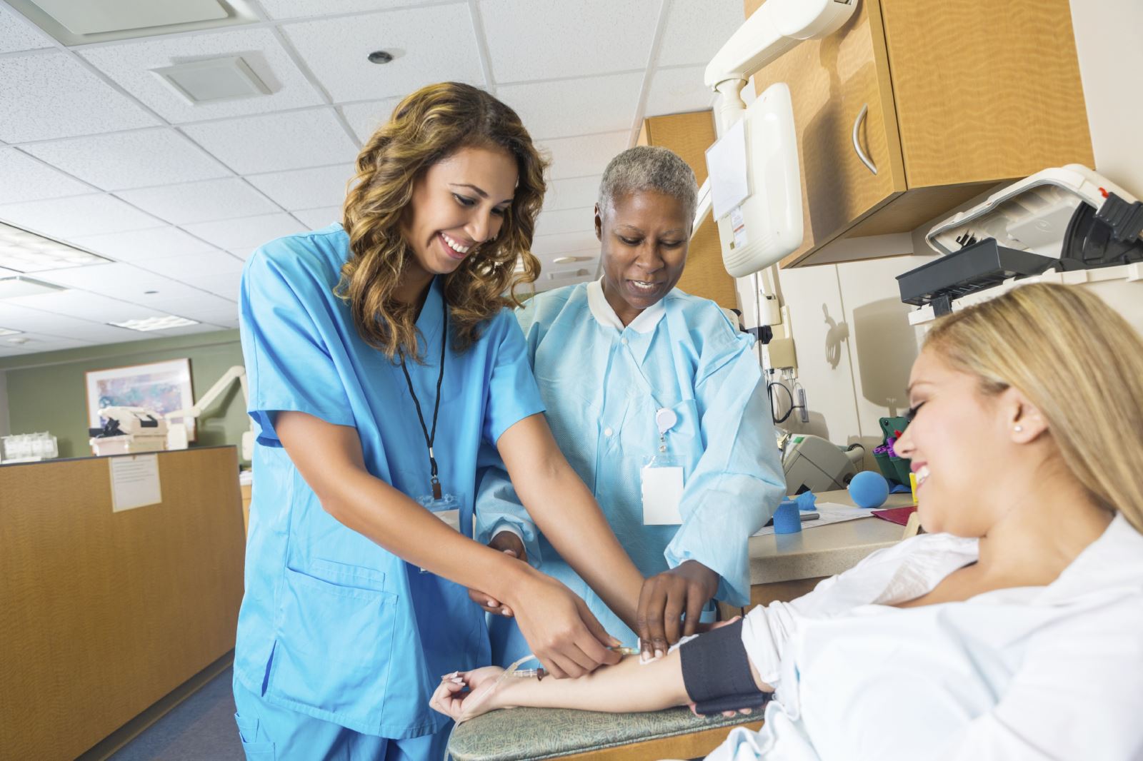 iStock_000049680142_Large Nurse Drawing Blood Work from Patient
